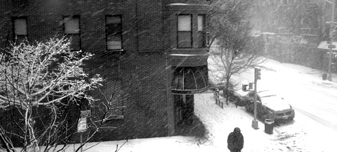view of man crossing the street on fifth ave in the snow