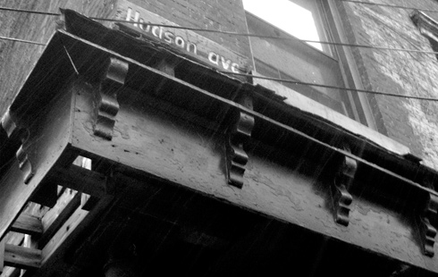 Hudson ave street sign corner buidling