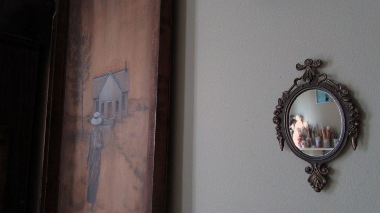a painting and a small mirror