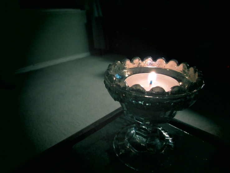 candle in a dark room