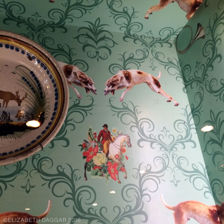 Wallpaper in a case of pottery. The whole museum is underpinned with a kind of tongue-in-cheek attitude.