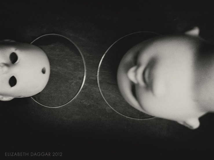 photo of two bisque dolls heads