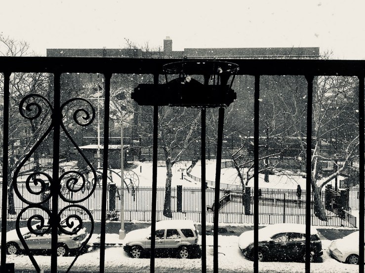 snow falling on the view of the playground (photo)