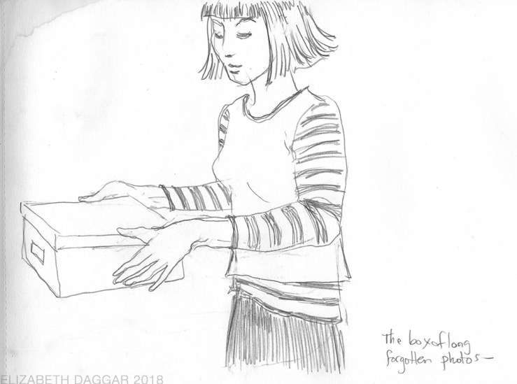 sketch of a woman holding a photo box