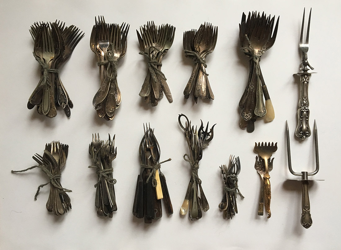 photo of the forks I've decided to keep, bundles for storage. (not including the strawberry forks, which are in a little box, as they are so delicate)