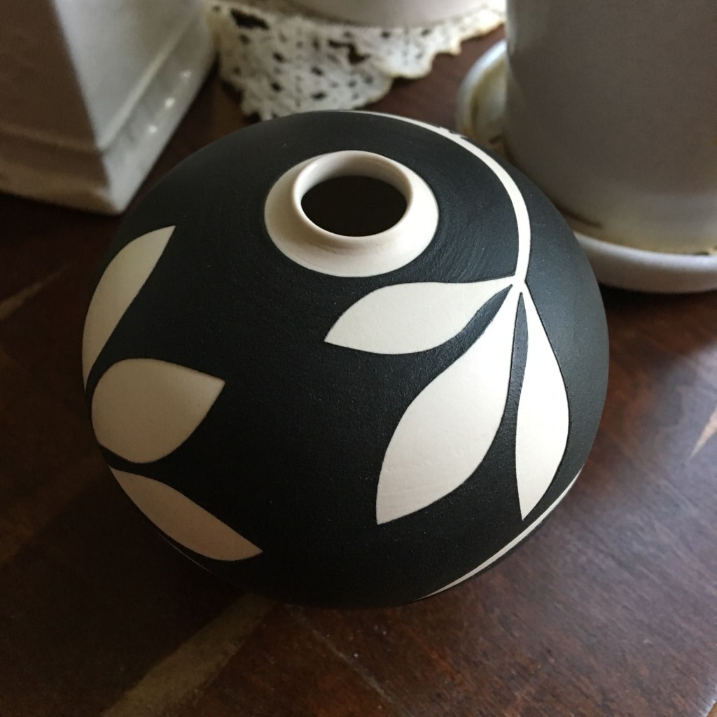 Photo of a small black and white ceramic vase I bought as part of the #ArtistSupportPledge